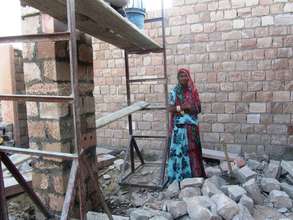 SHG member with construction for her new shop