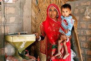 Mamta with her flour-grinding machine