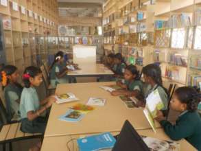 Children Reading Books in Library
