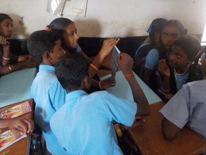 Kids selecting images form film negetives