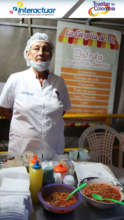 Beatriz stands at her empanada stall