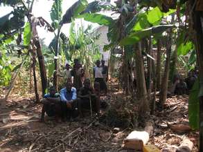 kids peeping through the banana trees