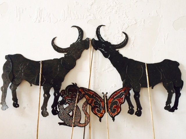 Two buffaloes, a butterfly and a monkey!