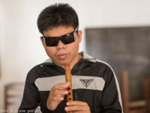 One of our Blind Students studying the Cloy (flute