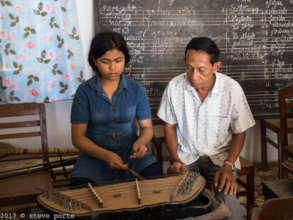 Our Mohori teacher teaching the Khim instrument