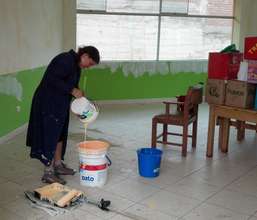 Teacher mixing cheerful color for her classroom