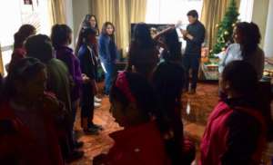Dr. Alejandro organizing meeting with girls