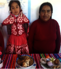 Adriana with her mother in her home