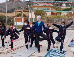 Volunteer Elaine teaches YOGA