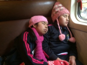 Tired girls after a very full day at MP-train home