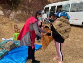 Mothers load up with food supplies and baby too.