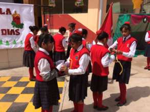 Retiring leaders pass on the symbols to new girls