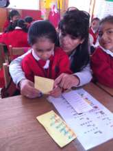 A student learning to read with Ruth
