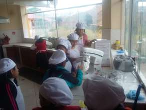 Girls learn how to bake, ingredients and equipment