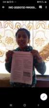 On student shows teacher her finished assignment