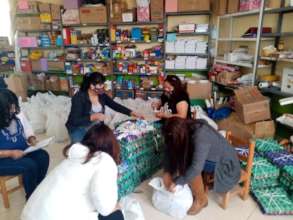 Teachers pack bags of food for families