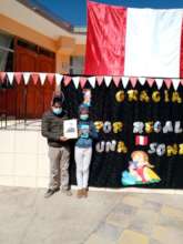 Papa with honored daughter holding Tablet reward