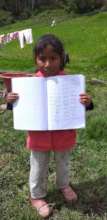 Student holds her work to be be sent to teacher
