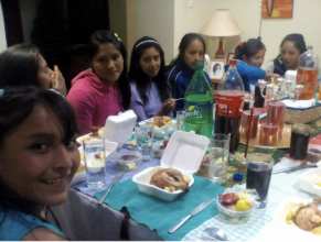 Ruth treats Alumnae girls BBQ chicken in her home