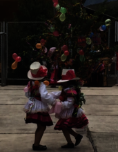 Carnival fun - 4 y/o girls dance around gift tree