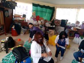 Teachers sort food for families