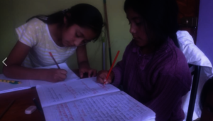 sisters learning at home