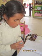 A student is focused on her project