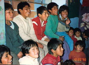 CW early shelter children-Efrain back row in red