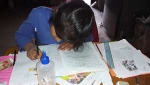 A very focus student on her assignment