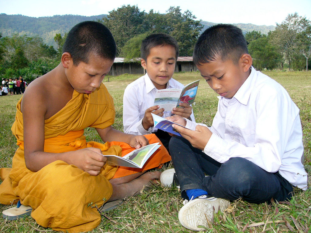 Provide books to children in villages in Laos