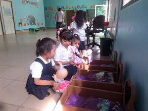 Some of our girls playing "mama" to their babies!
