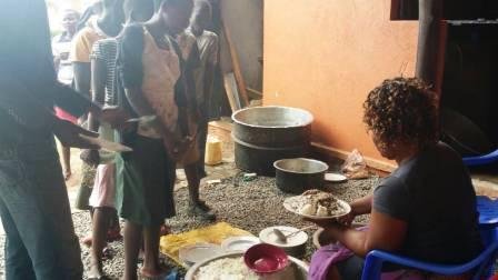 CHILDREN ENJOYING lunch