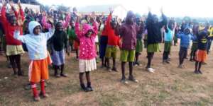 Happy children after receiving  rain Jackets