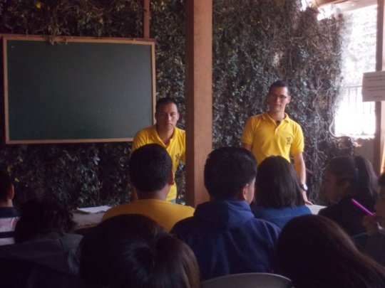 Saul teaching younger students in La Academia