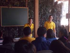 Saul teaching younger students in La Academia