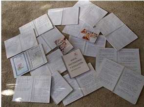 Student notebooks filled with reflections