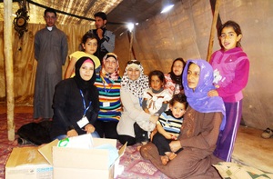 RI delivering a hygiene kit to Mumtaz's family