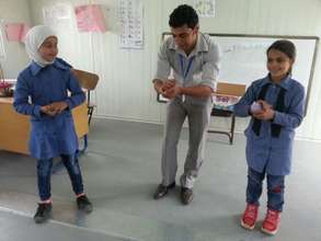 RI teaching some first-graders handwashing