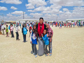 RI Emergency Response Coordinator with Syrian kids