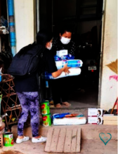 MH foster mother receiving milk and food supplies