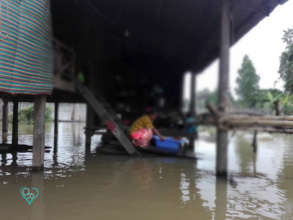 Closer view of a house in floodwater.