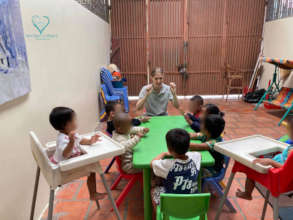 Children in the daycare enjoy listening to a story