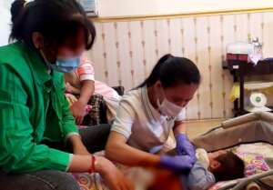 MH midwife performs routine check on a baby