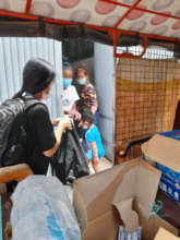 MH social worker distributing food support