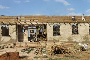 The roof goes on...