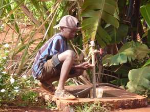 Abdullah washing his hands in the water spigot