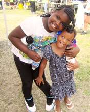 Sisters at K.I.D.S.' No Nonsense Sock Distribution
