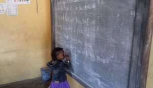Student writing on the board