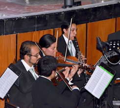 Giovanni and students in pit orchestra