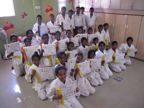 yellow orange and green belts in karate